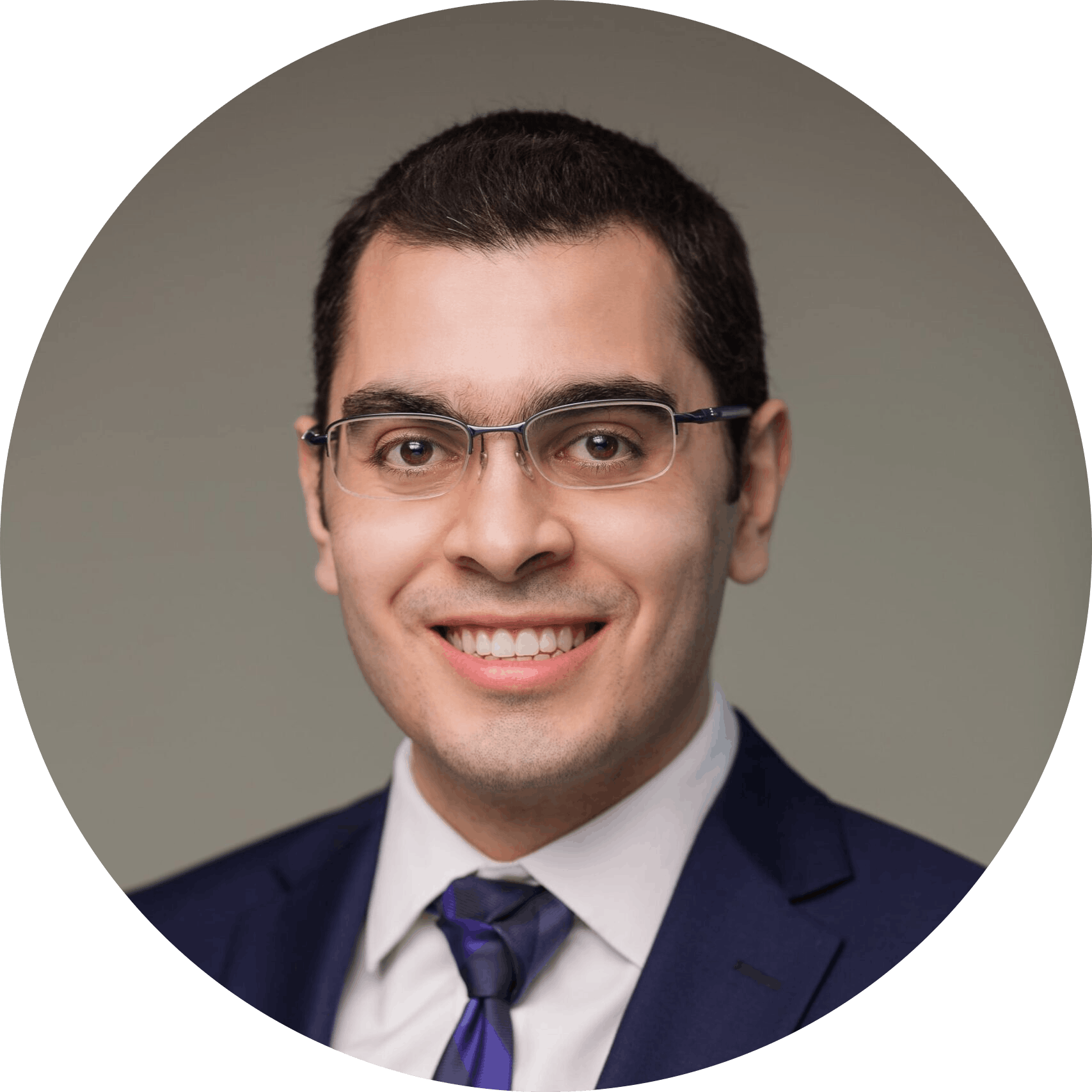 Professional circular cropped photo of Jad Saleh, founder of Manager In Practice, wearing a suit.