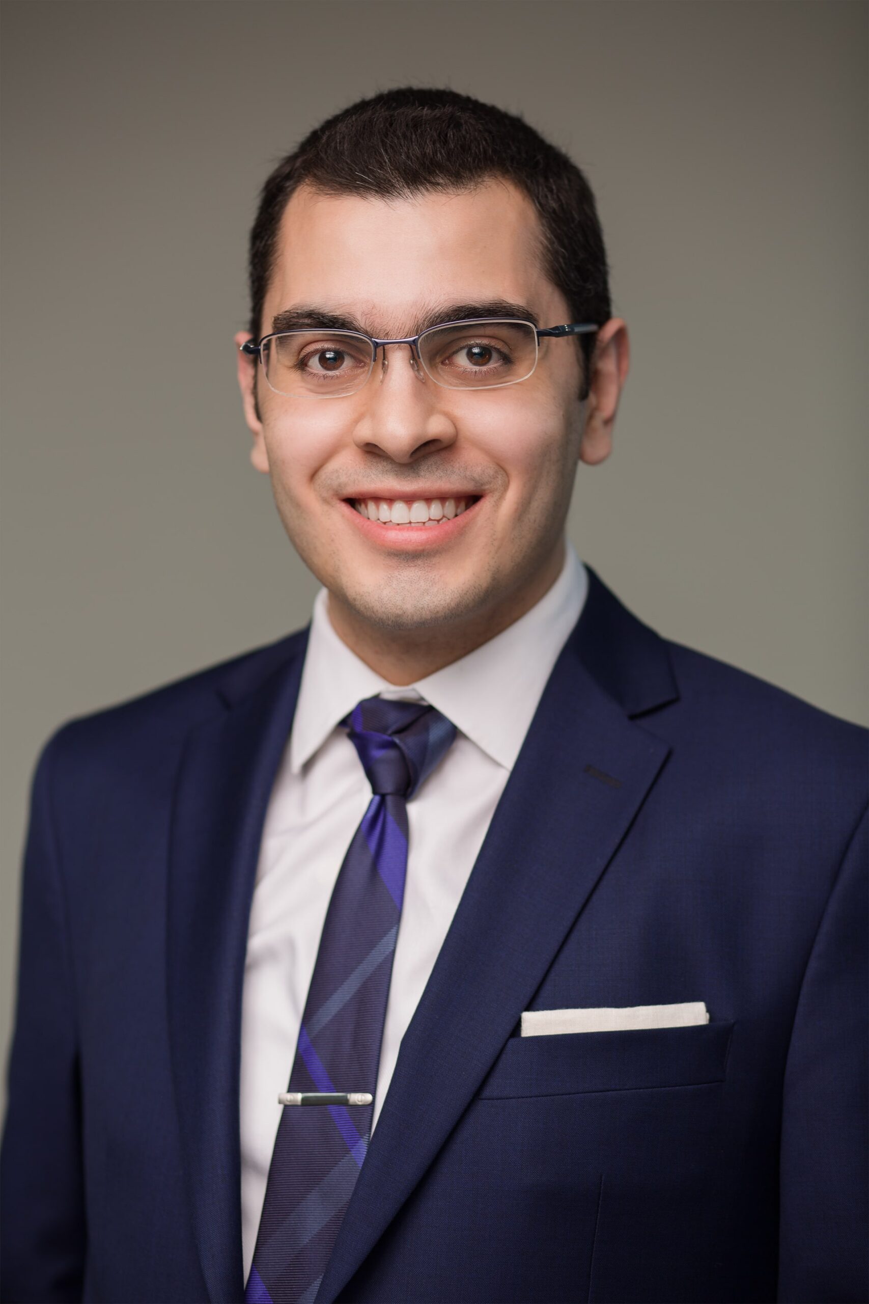 Professional headshot of Jad Saleh, founder of Manager In Practice, wearing a suit.